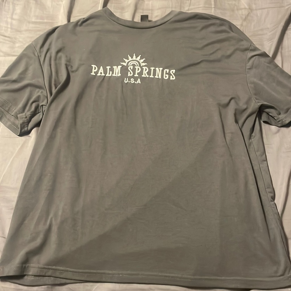 Dark grey oversized and embroidered t-shirt.